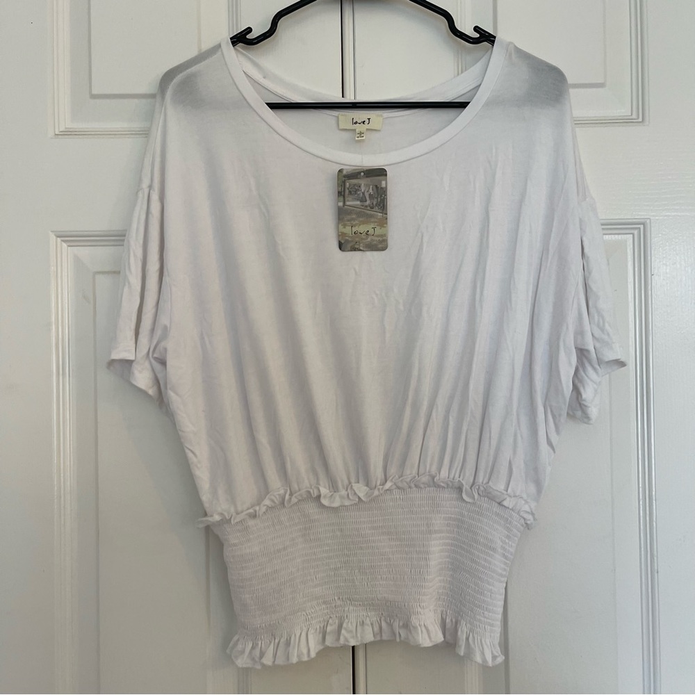 White shirt loose at the shoulders